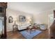 Elegant living room featuring hardwood floors, neutral decor, and a stylish blue area rug at 400 Fieldstone Lndg, Alpharetta, GA 30005