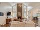 Inviting living room showcases stone fireplace, large windows, and an open layout at 400 Fieldstone Lndg, Alpharetta, GA 30005