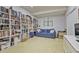 Finished basement provides a cozy space with built-in bookshelves and comfortable blue seating at 4274 Revere Cir, Marietta, GA 30062