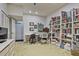 Finished basement that includes shelving, pinball machine, and workspace at 4274 Revere Cir, Marietta, GA 30062