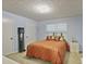 Comfortable bedroom with a bed featuring decorative pillows, complemented by soft lighting and neutral tones at 4274 Revere Cir, Marietta, GA 30062