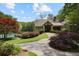 Landscaped path to clubhouse featuring a pool, decorative trees, and manicured bushes at 4274 Revere Cir, Marietta, GA 30062