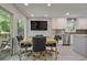 Bright dining area with access to deck and view of the kitchen and backyard at 4274 Revere Cir, Marietta, GA 30062