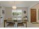 Bright dining room with hardwood floors, decorative chandelier, and an abundance of natural light at 4274 Revere Cir, Marietta, GA 30062