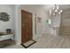 Home foyer featuring a chandelier, tile floor, and decorative artwork at 4274 Revere Cir, Marietta, GA 30062