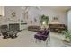 Bright living room featuring a vaulted ceiling, fireplace, and a piano at 4274 Revere Cir, Marietta, GA 30062