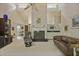 Spacious living room featuring a vaulted ceiling, fireplace, wet bar, and comfortable seating at 4274 Revere Cir, Marietta, GA 30062