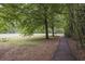 Peaceful community park with a walking path, picnic tables, and green spaces, perfect for outdoor recreation at 4274 Revere Cir, Marietta, GA 30062