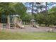 A vibrant playground nestled by a serene lake, offering a fun and scenic recreational space for children at 4274 Revere Cir, Marietta, GA 30062