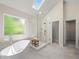 Bright bathroom featuring a soaking tub, walk-in shower, and a window for natural light at 6615 Callanwalde Ct, Suwanee, GA 30024