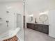 Bright bathroom featuring a double vanity, a modern shower, and neutral color palette at 6615 Callanwalde Ct, Suwanee, GA 30024