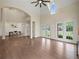 Open-concept living space featuring hardwood floors, a vaulted ceiling, and seamless transition to the dining area at 6615 Callanwalde Ct, Suwanee, GA 30024