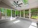 Bright sunroom with skylights and multiple windows offering views of the surrounding greenery at 6615 Callanwalde Ct, Suwanee, GA 30024