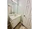 Bathroom features a single sink with vanity, a large mirror, and neutral paint at 75 Davis Mill Dr, Dallas, GA 30157