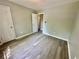 Bedroom with wood floors, fresh paint, and two closets at 75 Davis Mill Dr, Dallas, GA 30157