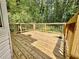Backyard deck with wood flooring and railings for outdoor enjoyment at 75 Davis Mill Dr, Dallas, GA 30157