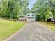 Exterior of a two-story home with a two-car garage and front porch at 75 Davis Mill Dr, Dallas, GA 30157