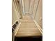Hallway with wood flooring and multiple doors on either side at 75 Davis Mill Dr, Dallas, GA 30157