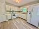 Well-equipped kitchen with classic white cabinets, modern appliances, and plenty of room for cooking at 75 Davis Mill Dr, Dallas, GA 30157