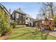 Large backyard with a playset, patio, and lush green lawn perfect for outdoor activities at 810 Kenry Ct, Atlanta, GA 30342