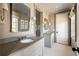 Bright bathroom with dual vanities, sleek fixtures, and large mirror, offering a functional and stylish space at 810 Kenry Ct, Atlanta, GA 30342