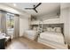 Charming bedroom featuring built-in bunk beds and a cozy reading nook by the window at 810 Kenry Ct, Atlanta, GA 30342