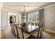 Sophisticated dining room featuring decorative wallpaper, a large dining table, and natural light at 810 Kenry Ct, Atlanta, GA 30342