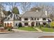 Gorgeous exterior view of house featuring a landscaped yard with a stone walkway to the front entrance at 810 Kenry Ct, Atlanta, GA 30342
