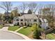 Elegant home featuring a well-manicured lawn, stone walkway, and detailed landscaping at 810 Kenry Ct, Atlanta, GA 30342
