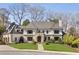 Beautiful two-story home with stone accents, a well-kept lawn, and mature trees at 810 Kenry Ct, Atlanta, GA 30342