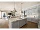 Bright, open kitchen features marble countertops, stainless steel appliances, and an island with a sink at 810 Kenry Ct, Atlanta, GA 30342