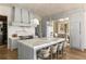 Well-appointed kitchen showcasing a large marble island, state-of-the-art appliances, and a stylish design at 810 Kenry Ct, Atlanta, GA 30342