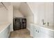 Functional laundry room featuring modern washer and dryer, ample counter space, and neutral tones, offering convenience and efficiency at 810 Kenry Ct, Atlanta, GA 30342
