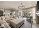 Elegant living room featuring hardwood floors, plush seating, and French doors leading to outdoor patio at 810 Kenry Ct, Atlanta, GA 30342