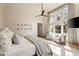 Bright main bedroom with sitting area, large windows, and view of backyard at 810 Kenry Ct, Atlanta, GA 30342