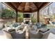 Outdoor living space has comfortable seating, fireplace and TV, perfect for relaxing or entertaining at 810 Kenry Ct, Atlanta, GA 30342