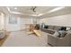 Large playroom with a ceiling fan, a cozy couch, and a custom jungle gym and slide at 810 Kenry Ct, Atlanta, GA 30342