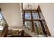 Bright staircase with floor-to-ceiling windows and a modern chandelier creates an inviting atmosphere at 810 Kenry Ct, Atlanta, GA 30342