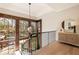 Bright stairwell with large windows, wooden accents and stylish light fixture, offering natural light and elegant design at 810 Kenry Ct, Atlanta, GA 30342