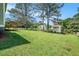 Exterior of home shows large backyard at 898 Doeskin Nw Dr, Conyers, GA 30012