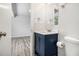 Stylish bathroom featuring a modern vanity, updated fixtures, and ample lighting, complemented by wood-look floors at 898 Doeskin Nw Dr, Conyers, GA 30012
