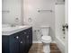 Bathroom features updated vanity, fixtures, and a shower-tub combo at 898 Doeskin Nw Dr, Conyers, GA 30012