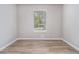Bedroom features wood-look flooring, neutral walls, and natural light at 898 Doeskin Nw Dr, Conyers, GA 30012