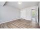 Bright bedroom features wood-look flooring, neutral walls, and closet at 898 Doeskin Nw Dr, Conyers, GA 30012