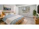 Comfortable bedroom with a wooden bed, soft bedding, and natural light at 898 Doeskin Nw Dr, Conyers, GA 30012