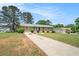 Charming ranch-style home featuring a spacious front yard, long drive, and quaint exterior details at 898 Doeskin Nw Dr, Conyers, GA 30012