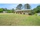 Well-maintained ranch-style home with a lush front yard and classic shutters, offering a welcoming curb appeal at 898 Doeskin Nw Dr, Conyers, GA 30012