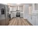 Modern kitchen features stainless steel appliances, ample cabinet space, and stylish countertop at 898 Doeskin Nw Dr, Conyers, GA 30012