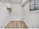 Utility room featuring modern floors, white walls and storage cabinets at 898 Doeskin Nw Dr, Conyers, GA 30012