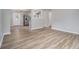 Open living room showcasing new wood floors, neutral wall paint, and seamless access to the kitchen at 898 Doeskin Nw Dr, Conyers, GA 30012